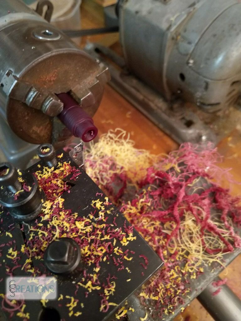 red and yellow swarf on the lathe
